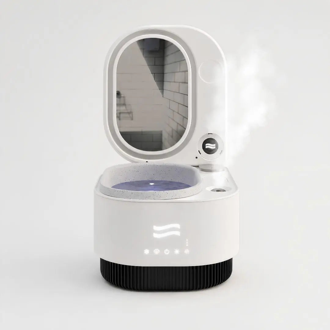 Frosteam 3-in-1 facial spa device with nano-ionic steam, cold plunge and aromatherapy, displayed on a luxury white studio background with visible steam.