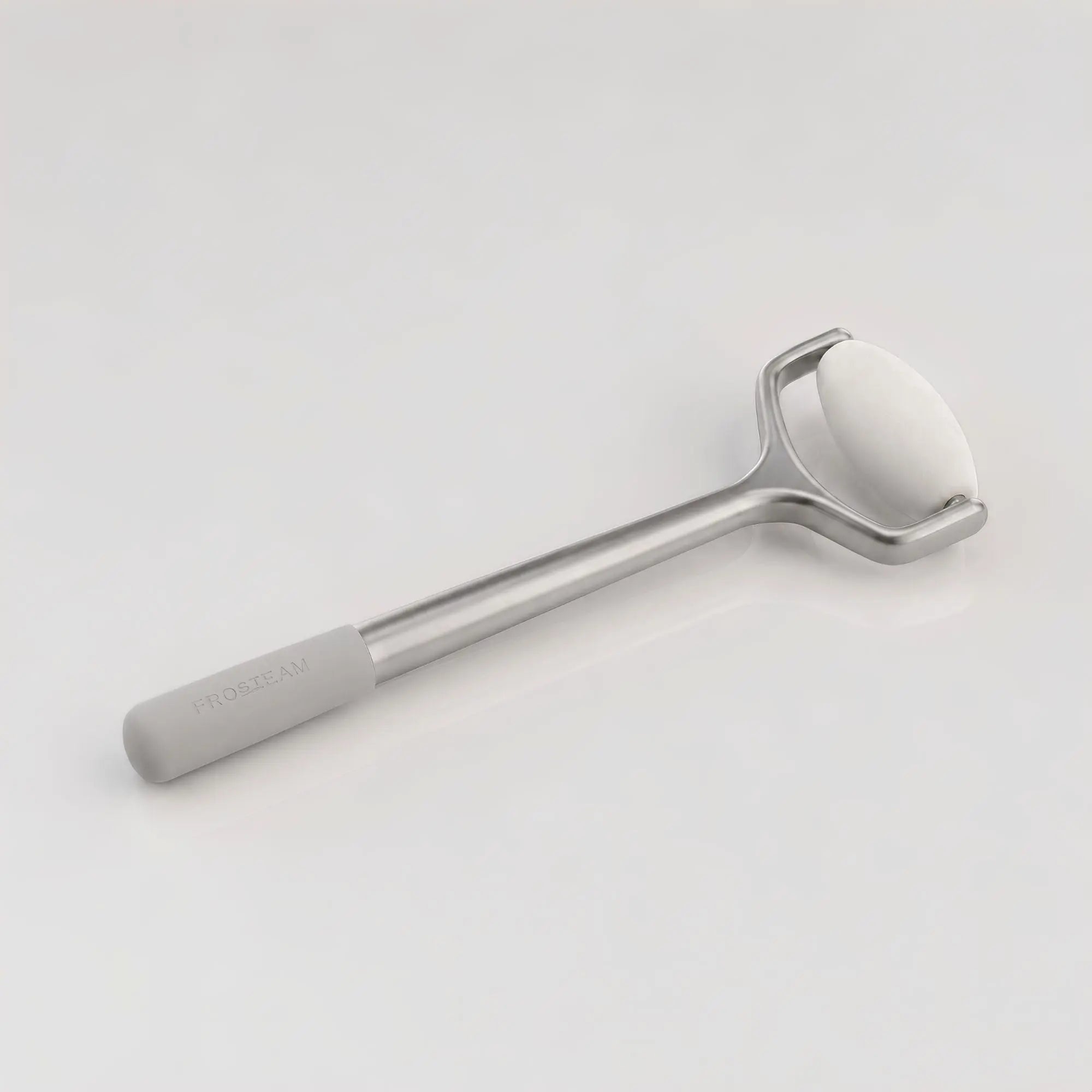 Premium Frosteam white jade facial roller designed to help massage, depuff and refresh the skin.