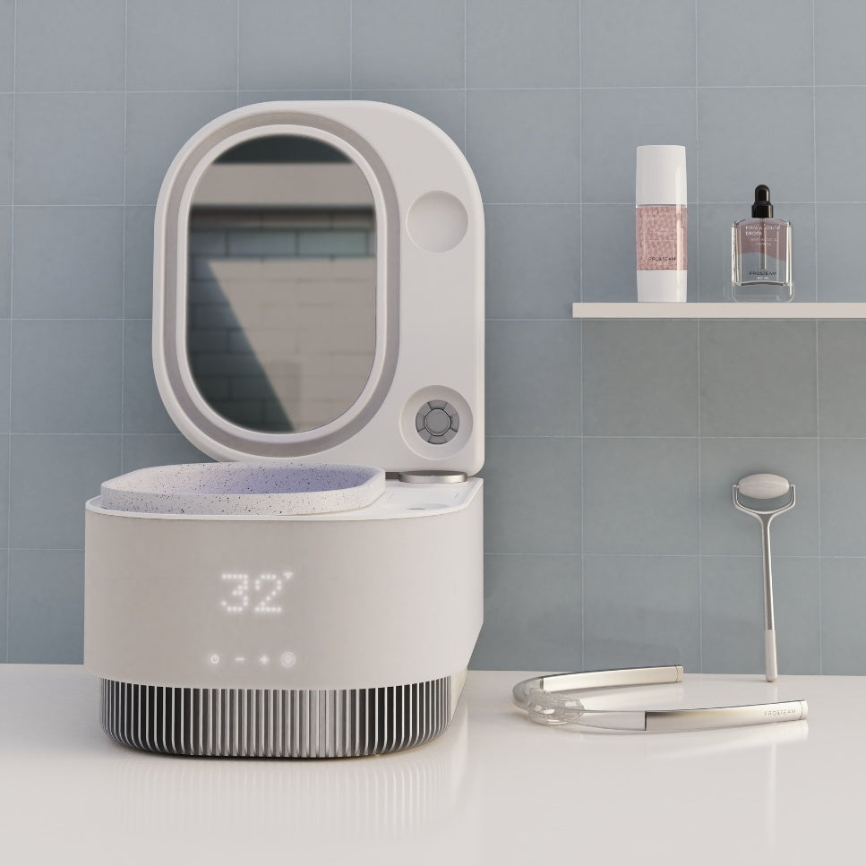 Frosteam 3-in-1 skincare device with mirror and accessories on bathroom counter