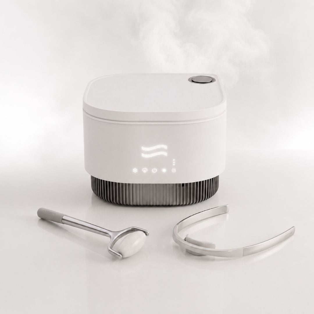 Frosteam Harmony device with facial roller and dive breather tool on white background