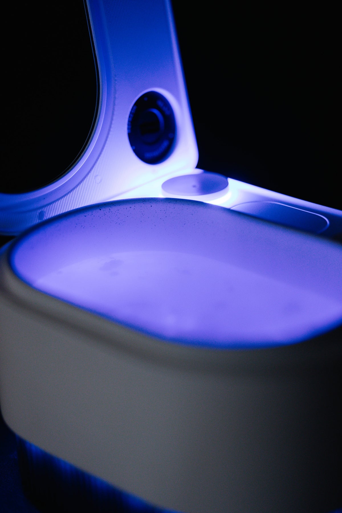 Frosteam Harmony basin lit in blue with the mirror lid open