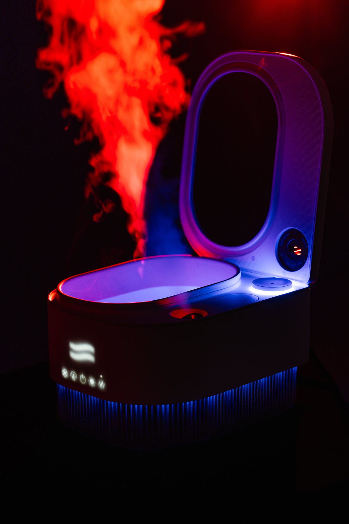 Frosteam Harmony with its lid open releasing steam, lit in red and blue