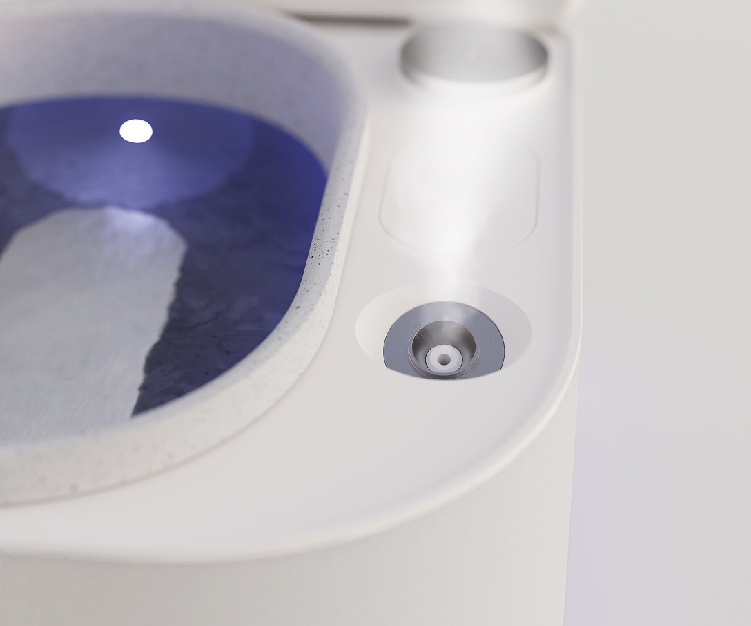 Close-up of Frosteam cold plunge bowl showing cold therapy water system designed to de-puff, tighten and refresh facial skin