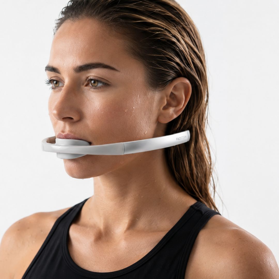 Woman using the Frosteam dive breather facial tool in profile, side view demonstration on white background