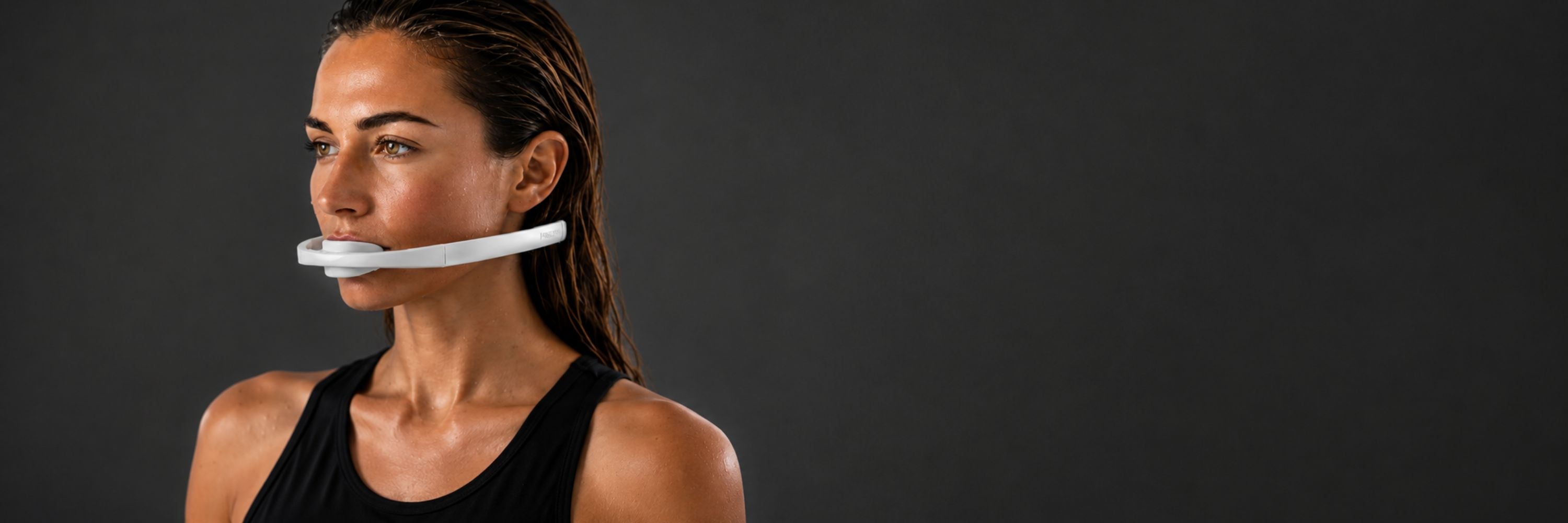 Woman wearing the Frosteam Dive Breather mouthpiece in side profile during breath training