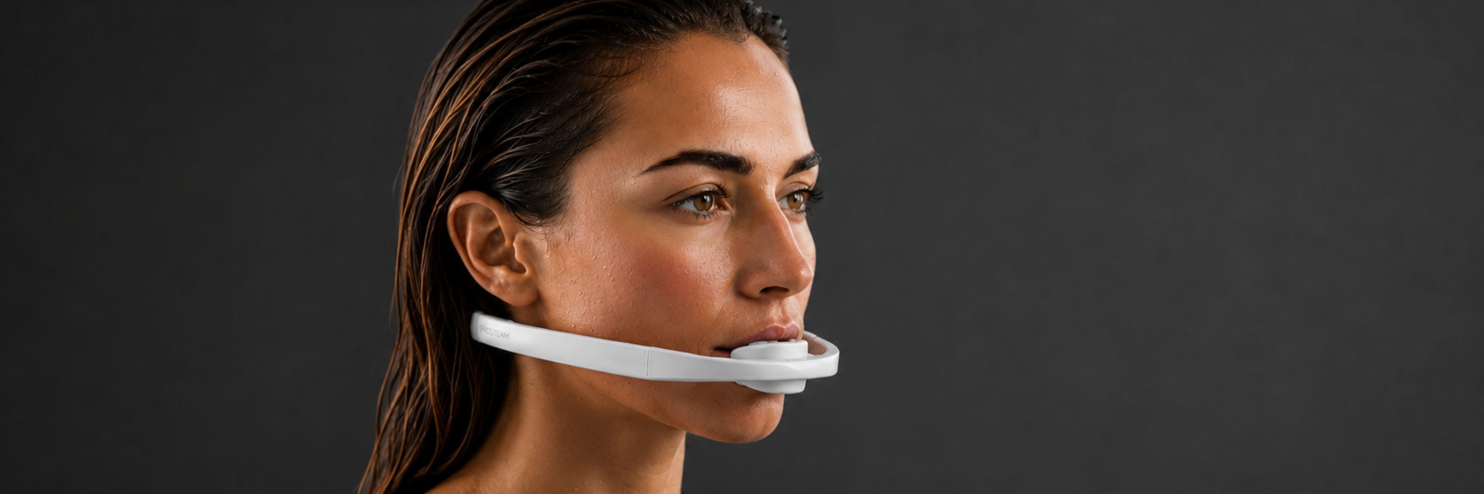 Woman wearing the Frosteam Dive Breather mouthpiece, close-up side profile