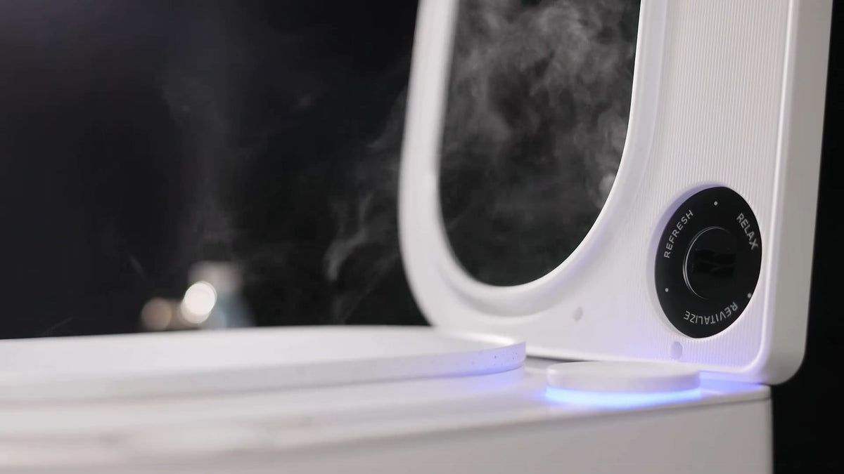 Frosteam Harmony aromatherapy dial with Refresh, Relax and Revitalize settings on the mirrored lid, steam rising