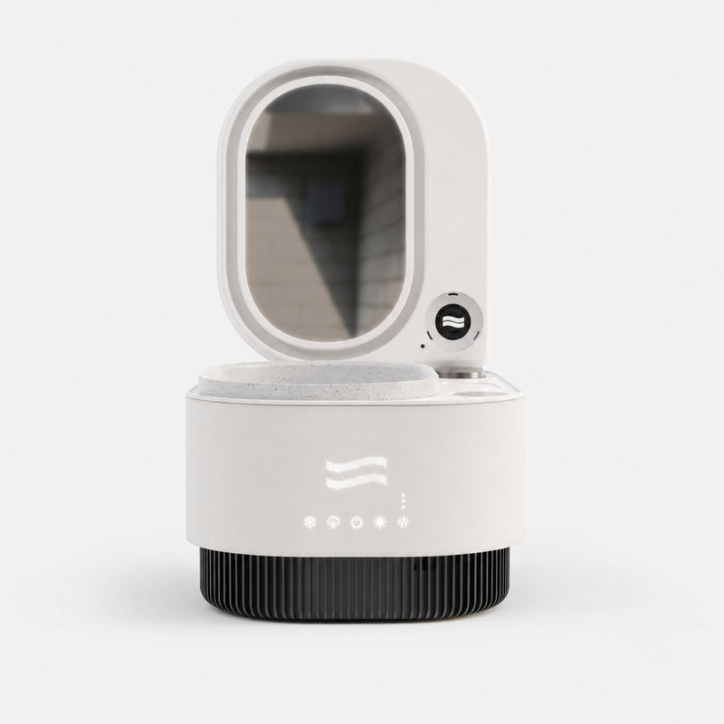 Frosteam Harmony 3-in-1 facial device with mirrored lid open, showing illuminated wave logo and touch controls